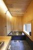 Modern home with Bath Room, Stone Counter, Ceramic Tile Floor, Wall Lighting, Open Shower, and Tile Counter. bath with Japanese "HINOKI" wall Photo 5 of My Kyoto Town House