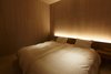 Modern home with Bedroom, Bed, Wall Lighting, Medium Hardwood Floor, and Ceiling Lighting. 1st bed room Photo 8 of My Kyoto Town House