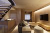 Modern home with Living Room, Table Lighting, Chair, Ceiling Lighting, Floor Lighting, Sofa, Wall Lighting, Light Hardwood Floor, Bench, and Medium Hardwood Floor. round room Photo 17 of My Kyoto Town House