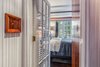 Modern home with Hallway and Medium Hardwood Floor. Hallway to Master Bedroom plus custom mahogany switch plate Photo 7 of The Yacht House