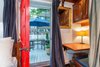Second bedroom to patio featuring yacht-inspired navigation station Photo 9 of The Yacht House modern home