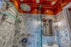 Modern home with Bath Room, Recessed Lighting, Marble Floor, Pedestal Sink, Open Shower, Wood Counter, Marble Wall, Ceiling Lighting, One Piece Toilet, and Wall Lighting. Shower with beadboard ceiling Photo 12 of The Yacht House