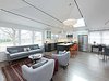 Modern home with Living Room, Light Hardwood Floor, Ceiling Lighting, Standard Layout Fireplace, and Gas Burning Fireplace. Great Room created by vaulting the, ceiling, adding large 4'x4' skylights and industrial steel structural rods Photo 2 of the Humble Ranch- Re-Imagined