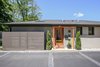 Modern home with Exterior, Shingles Roof Material, and House Building Type. Side entrance with custom glass and steel awning Photo 3 of the Humble Ranch- Re-Imagined
