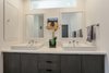 Modern home with Bath Room, Engineered Quartz Counter, Enclosed Shower, Vessel Sink, Two Piece Toilet, and Porcelain Tile Floor. custom built mid century style double vanity. notice transom window above sinks brink in natural light Photo 13 of the Humble Ranch- Re-Imagined