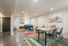 rec room with epoxy floors, white walls and recessed lighting Photo 14 of the Humble Ranch- Re-Imagined modern home
