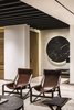 Modern home with Living Room, Travertine Floor, and Chair. At the main access, a bold and striking marble element decorates the space Photo of Apartment in Ahuehuetes Norte