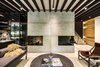 Modern home with Living Room, Coffee Tables, Chair, Corner Fireplace, Ceiling Lighting, Sofa, Two-Sided Fireplace, and Light Hardwood Floor. Local furniture and decoration was considered Photo 4 of Apartment in Ahuehuetes Norte