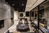 Modern home with Living Room, Coffee Tables, Corner Fireplace, Ceiling Lighting, Chair, and Light Hardwood Floor. Living room Photo 10 of Apartment in Ahuehuetes Norte
