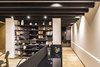 A steel bookcase designed by the firm divides the space Photo 12 of Apartment in Ahuehuetes Norte modern home