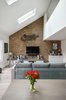 Modern home with Living Room, Track Lighting, Recessed Lighting, Console Tables, Sofa, End Tables, Chair, Accent Lighting, Ceiling Lighting, Coffee Tables, and Light Hardwood Floor. The front view of the Living areas from the Dining Photo 3 of Olympia Loft