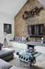 Modern home with Living Room, Recessed Lighting, End Tables, Bench, Ceiling Lighting, Track Lighting, Coffee Tables, Accent Lighting, Console Tables, and Light Hardwood Floor. The Living area with its TVR engine that supports the bespoke sofa table, the 1960s photos and furniture and the blue and grey tones of the fabrics Photo 5 of Olympia Loft
