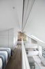 Modern home with Accent Lighting and Light Hardwood Floor. The Master bedroom ensuite faces through a large internal glazing the living areas below Photo 14 of Olympia Loft
