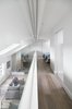 Modern home with Accent Lighting and Light Hardwood Floor. The Master bedroom ensuite faces through a large internal glazing the living areas below Photo 12 of Olympia Loft