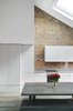 Modern home with Kitchen, Light Hardwood Floor, Dishwasher, Engineered Quartz Counter, Refrigerator, Undermount Sink, Track Lighting, Accent Lighting, Cooktops, Ceiling Lighting, Recessed Lighting, Range Hood, and White Cabinet. Front Detail of the Kitchen Photo 9 of Olympia Loft