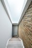 Modern home with Staircase and Wood Tread. The internal spirally-shaped staircase with the long skylight above Photo 11 of Olympia Loft