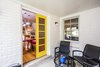 Modern home with Outdoor, Concrete Patio, Porch, Deck, Side Yard, Trees, Small Patio, Porch, Deck, and Grass. Bright and cheerful seasonal screened porch makes for the perfect breakfast nook. Photo 7 of Wren's Nest