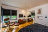 Modern home with Bedroom, Wardrobe, Light Hardwood Floor, Chair, Pendant Lighting, Night Stands, Recessed Lighting, and Bed. Black-out top-down-bottom-up shades, custom closet and full mirrored pocket doors make the difference in your stay. Photo 8 of Wren's Nest