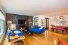 Modern home with Living Room, Pendant Lighting, Sofa, End Tables, Gas Burning Fireplace, Coffee Tables, and Light Hardwood Floor. Relax in loft like style. Photo 3 of Wren's Nest