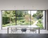 Modern home with Dining Room, Concrete Floor, Pendant Lighting, and Table. Generous glazing mimics the experience of dining outdoors. Photo 3 of Oatlands