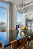Modern home with Dining Room, Table, Medium Hardwood Floor, Ceiling Lighting, and Chair. In the dining room, a commissioned piece from the cuban artist Frank Mujica is framed by a mid-century dining table from Dune and chairs from Hive Modern. Photo 7 of Central Park West Penthouse