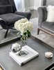 Modern home with Living Room, Dark Hardwood Floor, Chair, and Coffee Tables. Looking for a new start and completely unique furnishings for their home, Urszula worked closely with the family so they could feel comfortable with a fresh take on Old Greenwich interior design unlike any of their neighbors. Photo 3 of Revitalized Old Greenwich Home
