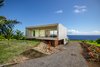 Modern home with Office, Bookcase, Chair, Desk, Study Room Type, Library Room Type, Storage, Shelves, Craft Room Room Type, and Concrete Floor. QK Office Photo 4 of QK Haiku