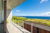 Modern home with Outdoor, Horizontal Fences, Wall, Raised Planters, Garden, Front Yard, Gardens, Grass, Rooftop, Hardscapes, Stone Fences, Wall, Stone Patio, Porch, Deck, Trees, Flowers, Wood Fences, Wall, Concrete Fences, Wall, Decking Patio, Porch, Deck, Wire Fences, Wall, Large Patio, Porch, Deck, Post Lighting, and Wood Patio, Porch, Deck. Green Roof and Ocean View Photo 6 of QK Haiku