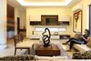 Modern home with Living Room and Ceiling Lighting. Interior Photo of COME IN! Family is in the courtyard