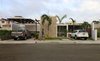 Modern home with Exterior, House Building Type, Concrete Siding Material, Metal Roof Material, and Flat RoofLine. Front view Photo 6 of COME IN! Family is in the courtyard