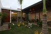 Modern home with Outdoor, Trees, Tile Patio, Porch, Deck, Wood Patio, Porch, Deck, Wood Fences, Wall, Grass, Hanging Lighting, Metal Fences, Wall, Garden, Concrete Patio, Porch, Deck, and Concrete Fences, Wall. Courtyard Photo 9 of COME IN! Family is in the courtyard