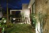 Modern home with Outdoor, Flowers, Trees, Grass, Garden, Wood Fences, Wall, and Stone Fences, Wall. Entrance Photo 4 of COME IN! Family is in the courtyard