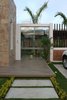 Modern home with Outdoor, Hanging Lighting, Grass, Trees, Tile Patio, Porch, Deck, Concrete Patio, Porch, Deck, Wood Fences, Wall, and Front Yard. Entrance Photo 7 of COME IN! Family is in the courtyard