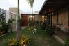Modern home with Outdoor, Wood Patio, Porch, Deck, Stone Fences, Wall, Grass, Concrete Patio, Porch, Deck, Garden, Flowers, Concrete Fences, Wall, Trees, Tile Patio, Porch, Deck, and Hanging Lighting. Courtyard Photo 8 of COME IN! Family is in the courtyard