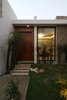 Modern home with Outdoor, Wood Patio, Porch, Deck, Walkways, Grass, Metal Fences, Wall, Concrete Patio, Porch, Deck, Tile Patio, Porch, Deck, Shrubs, Concrete Fences, Wall, Hanging Lighting, Stone Fences, Wall, Garden, and Wood Fences, Wall. Courtyard Photo 10 of COME IN! Family is in the courtyard