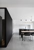 Modern home with Kitchen, Ceiling Lighting, Concrete Floor, and White Cabinet. “Reinforcing the degree of abstraction of the project, the choice of the minimalist furniture and lamps echoes the palette of textures composed of concrete, wood, and steel,” add the architects. Photo 2 of Bessborough Residence