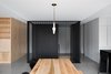 Modern home with Staircase, Metal Railing, and Metal Tread. Lambert & Fils' Dot Line Suspension lamp hangs over an Allais Table by The Gaspé. Photo 4 of Bessborough Residence