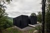 Modern home with Exterior, Cabin Building Type, Wood Siding Material, Shed RoofLine, Metal Roof Material, and House Building Type. The entrance is located between the two volumes, which are oriented in slightly different directions. Photo 6 of La Binocle