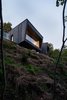 Modern home with Outdoor, Slope, Wood Fences, Wall, Trees, Vertical Fences, Wall, Small Patio, Porch, Deck, Wood Patio, Porch, Deck, Shrubs, Woodland, and Decking Patio, Porch, Deck. La Binocle is perched high atop a hill, maximizing views of the valley below. Photo 2 of La Binocle