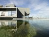 Modern home with Exterior, House Building Type, and Flat RoofLine. The design of this unique structure was oriented toward the exterior panoramic view. Beyond the western façade is a natural swimming pond. Photo 2 of Where the Eagles Live