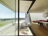 Modern home with Living Room, Sofa, Sectional, and Light Hardwood Floor. When open, corner windows in the main living area allow for a semi-outdoor transformation during summer months. Photo 6 of Where the Eagles Live