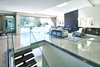 Modern home with Living Room, Chair, End Tables, Coffee Tables, Gas Burning Fireplace, Sofa, and Recessed Lighting. This custom-built estate embraces indoor/outdoor living with an open floor plan and multiple entertainment areas. Photo 2 of Via Victoria