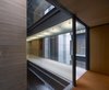 Modern home with Hallway. Stone, wood, glass parapets and steel plates, main materials used in the building Photo 6 of Madroños 27