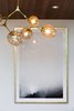 Modern home with Living Room, Ceiling Lighting, Recessed Lighting, and Pendant Lighting. Modern pool house, designed by JBellessa Design. Light fixture: Lindsey Adelman. Artwork: Restoration Hardware. Photo 6 of Modern Mountain Pool House