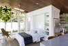 Modern home with Recessed Lighting, Concrete Floor, and Ceiling Lighting. To keep the space flexible and functional, Bellessa and Clyde designed a built-in Murphy bed that can be pulled down to accommodate a guest. When stowed away, the bed’s painted panel disappears into the wall—and frees up floor space for parties. Photo 11 of Modern Mountain Pool House