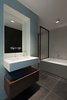 Modern home with Bath Room, Ceramic Tile Wall, Stone Counter, Ceramic Tile Floor, Drop In Tub, Drop In Sink, One Piece Toilet, Concrete Wall, Enclosed Shower, and Ceiling Lighting. Bathroom Photo 11 of Super Loft by studiomfd Amsterdam