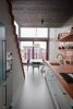 Modern home with Kitchen, Ceramic Tile Backsplashe, Wood Counter, Wall Oven, Concrete Floor, Colorful Cabinet, Microwave, Cooktops, Recessed Lighting, Ceiling Lighting, and Drop In Sink. Kitchen & Dining Photo 4 of Super Loft by studiomfd Amsterdam