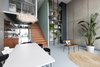 Modern home with Living Room, Chair, Bench, Concrete Floor, Pendant Lighting, and End Tables. Living Room Photo of Super Loft by studiomfd Amsterdam