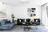 Modern home with Living Room, Coffee Tables, Ceiling Lighting, Rug Floor, Porcelain Tile Floor, and Sofa. Living area Photo 2 of MG House