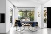 Modern home with Living Room, Chair, Rug Floor, Coffee Tables, Bench, Ceiling Lighting, and Porcelain Tile Floor. Living area Photo of MG House